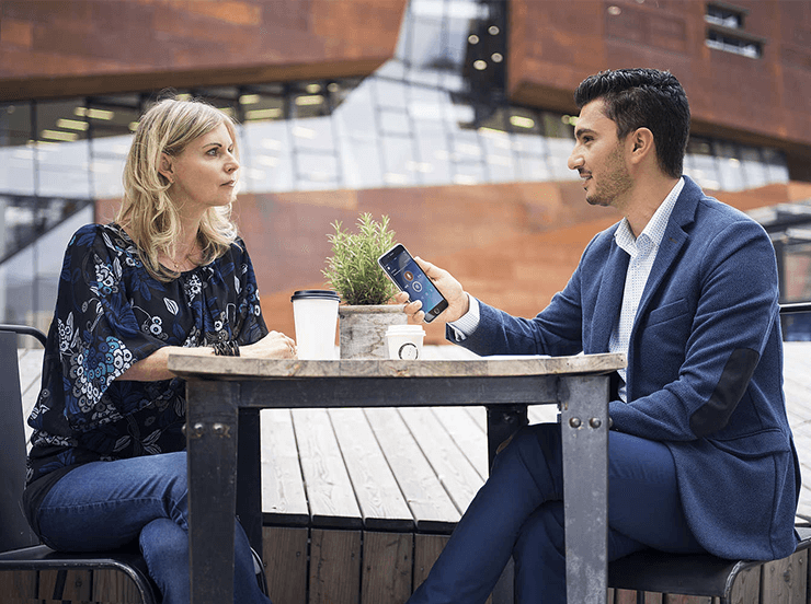 Couple at table using the Philips Dictation App.